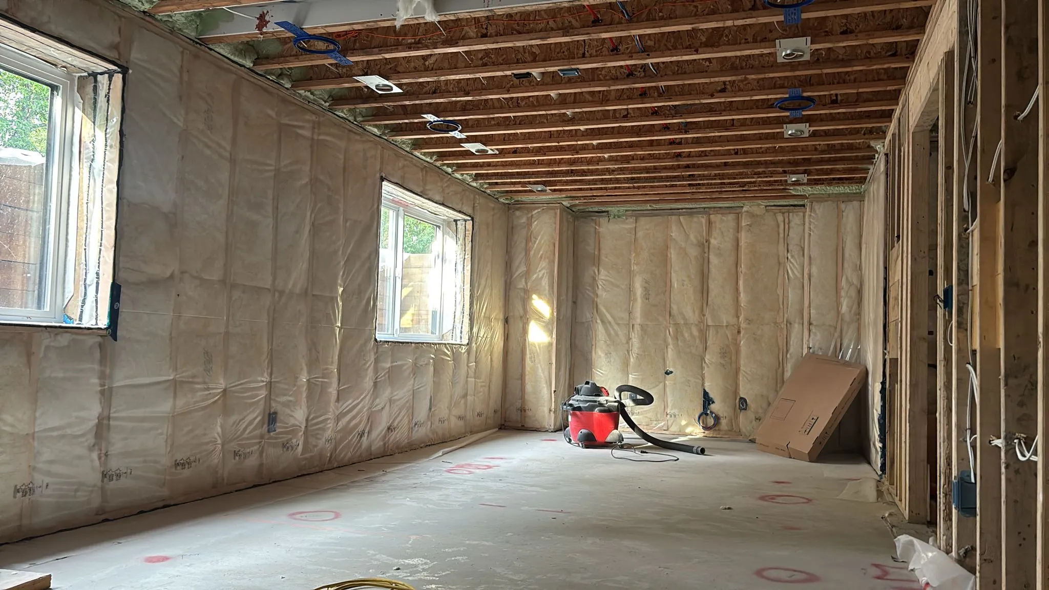 Room interior wrapped in vapour barrier after insulation